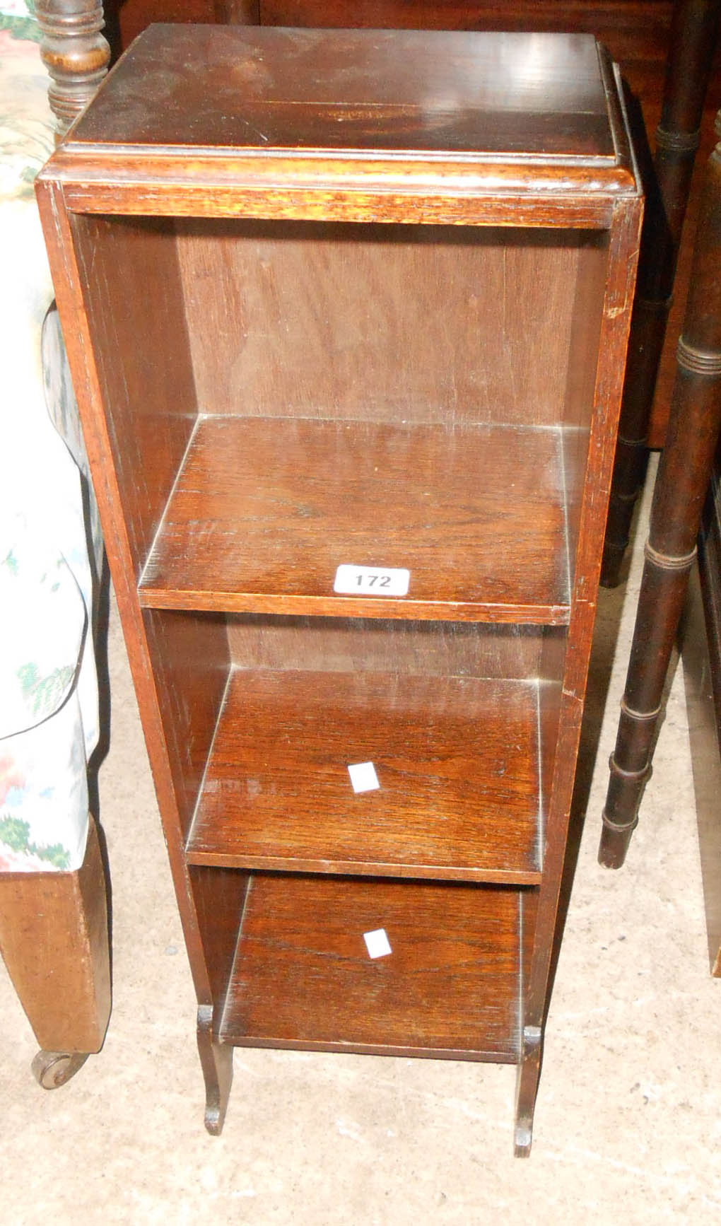 A vintage small narrow stained oak three shelf open bookcase