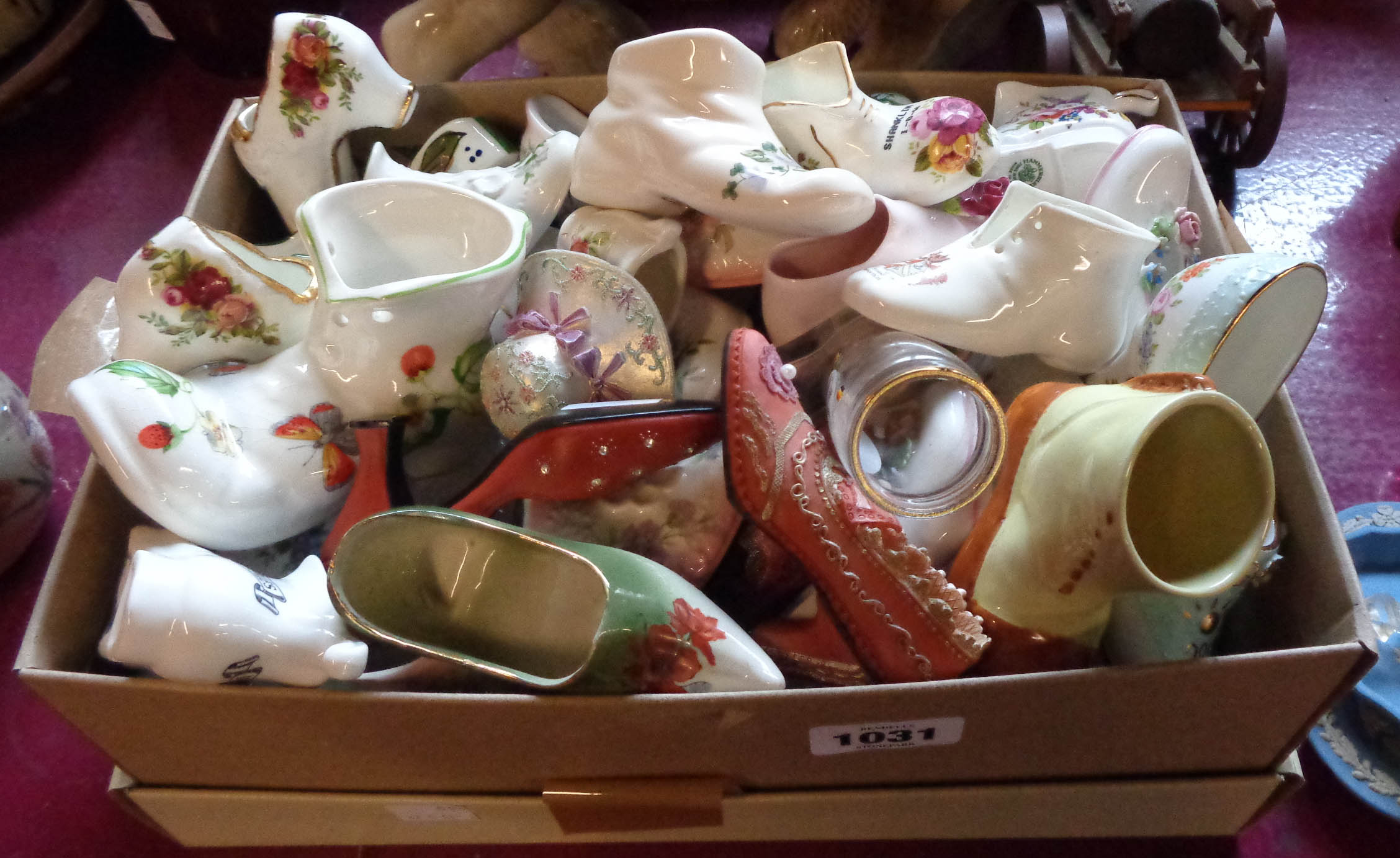A box containing a large quantity of ceramic and other collectable shoes including Royal Albert