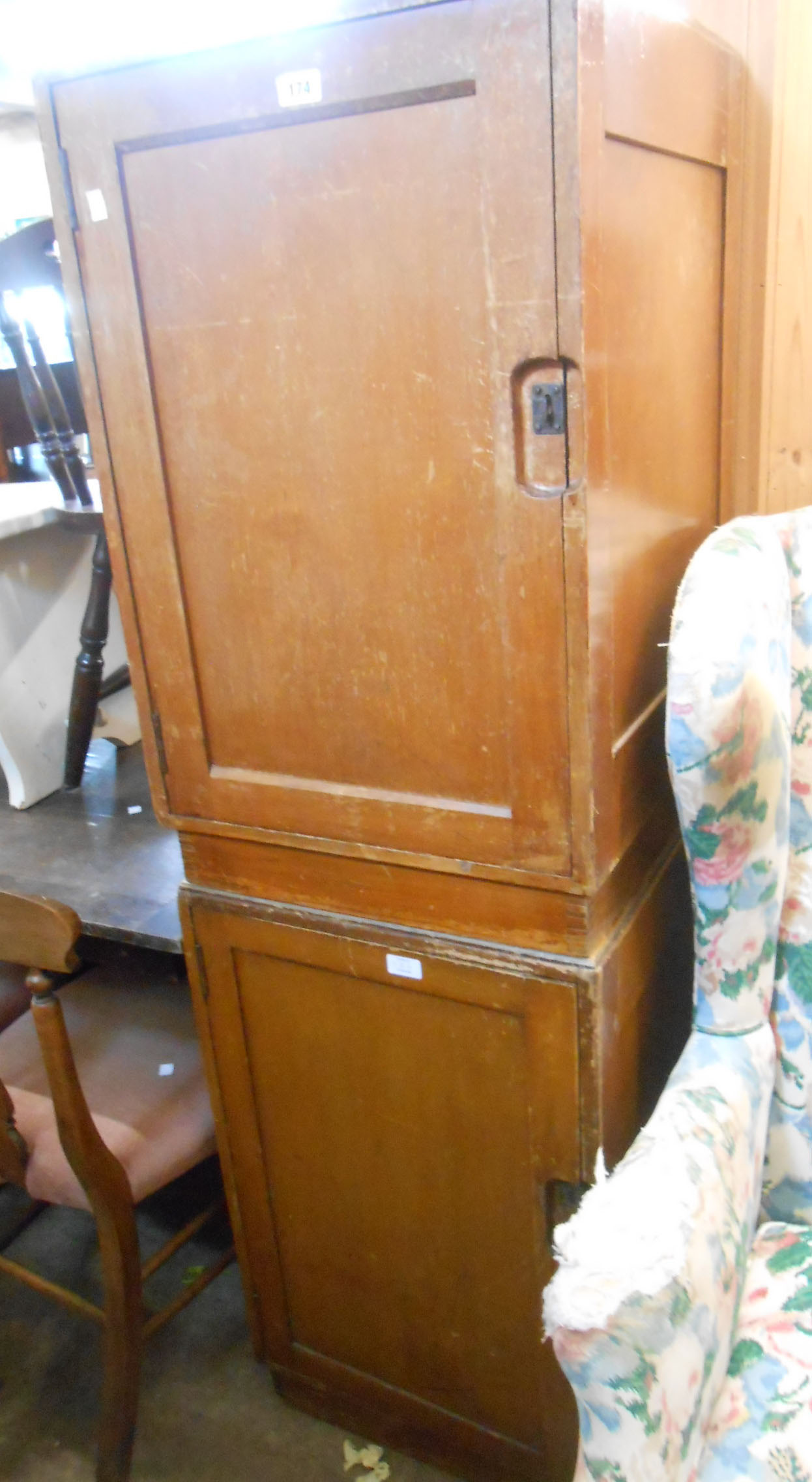 A pair of 50cm Lebetkin Bros. Ltd. 1952 stained mixed wood cupboards with hasp locking doors - wear