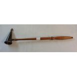 A silver candle snuffer with flambeau finial on turned fruitwood handle