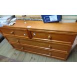 A 1.01m retro G-Plan teak effect chest of two short and two long drawers with knob handles