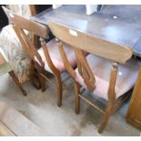 A pair of old stained beech framed standard chairs with old rose upholstered seats, set on turned