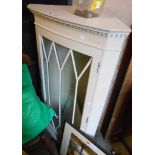 A 58cm vintage later painted corner cabinet with glazed panel door, set on bracket base