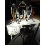 A 1.35m vintage French style white painted and parcel gilt kidney shaped dressing table with