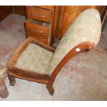 A Victorian mahogany framed scroll back nursing chair with tapestry upholstery, set on turned