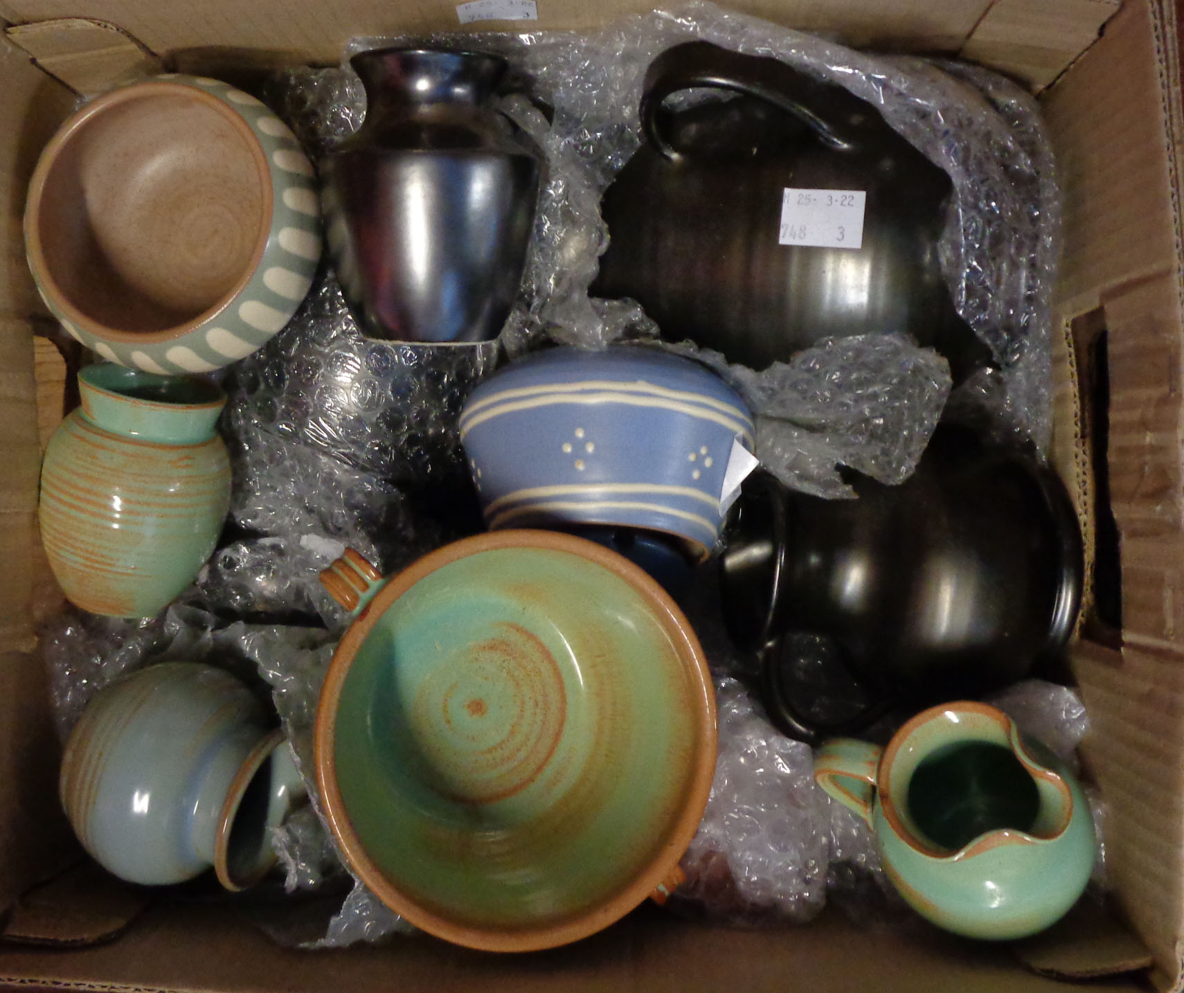 A box containing a quantity of Prinknash Pottery