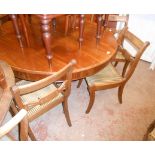 A set of six reproduction mahogany framed sabre legs dining chairs with upholstered seats