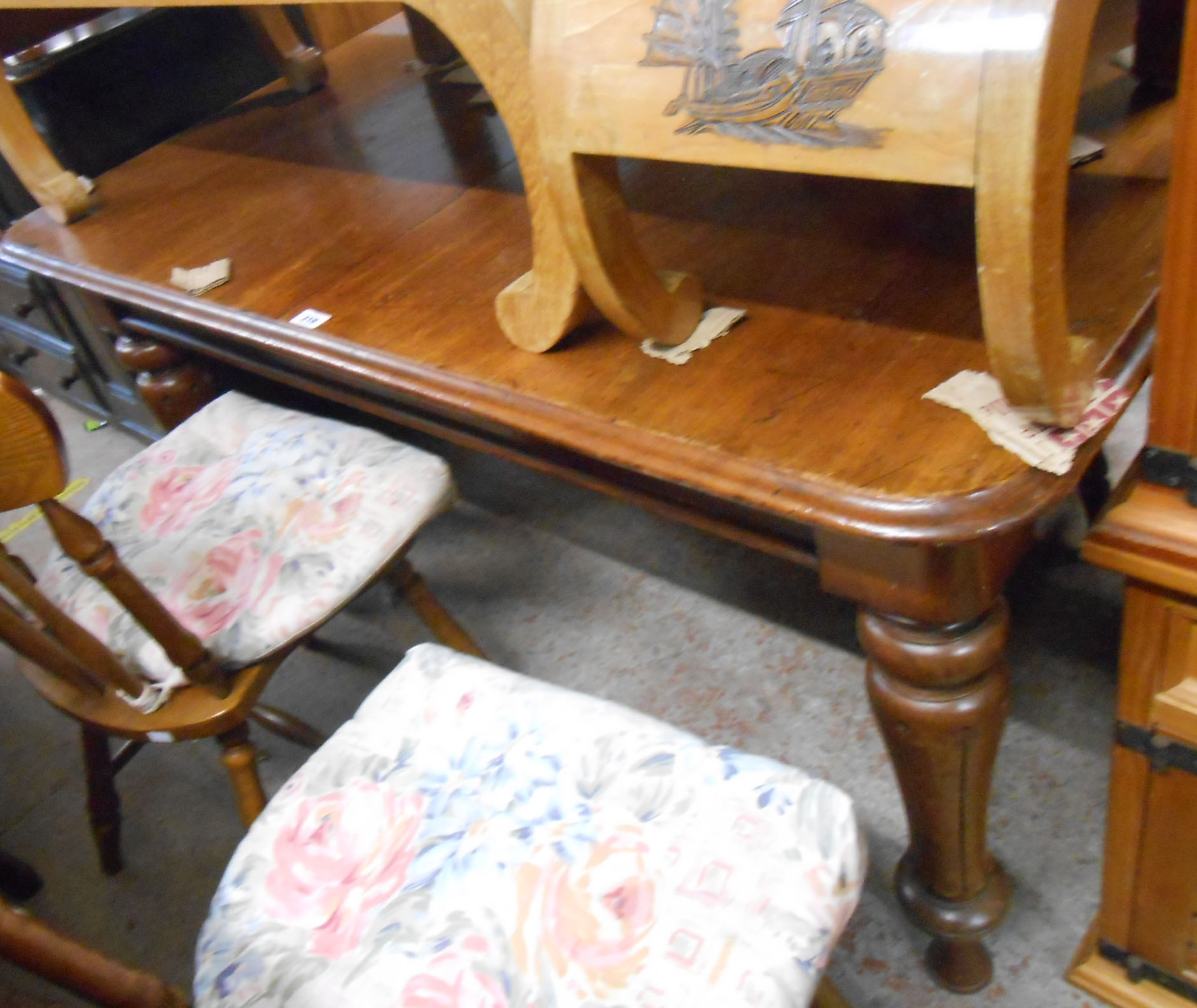 A 1.4m Victorian mahogany draw-frame extending dining table, set on turned and fluted legs