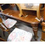A 1.4m Victorian mahogany draw-frame extending dining table, set on turned and fluted legs