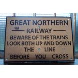 A modern painted cast iron Great Northern Railway sign