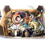 A box containing a large quantity of assorted costume jewellery including necklaces, bangles, etc.