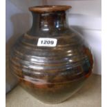 A large David Leach studio pottery vase of baluster form with short neck covered in a brown