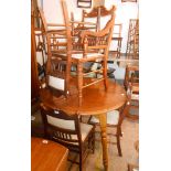 A set of six Edwardian walnut framed dining chairs with upholstered panel backs, comprising four