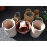 A selection of Bristol glaze storage jars, terracotta flowerpots, etc.