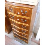 A 50cm reproduction yew wood serpentine front chest with flight of six drawers, set on bracket feet