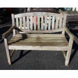 A Lindsay teak two seater garden bench