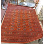 A machine made Belgian rug with central repeat medallion within a geometric and flowerhead