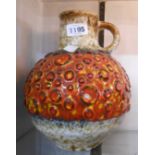 A vintage West German pottery handled vase of bulbous form with central raised decorative band