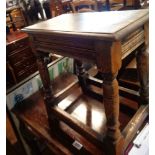 An oak antique style joint stool with moulded apron and turned supports