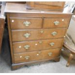 A 97cm late Georgian oak chest of two short and three long graduated drawers, set on bracket