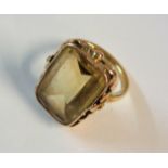 An 18ct. gold dress ring, set with a large oblong citrine stone - boxed