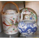 A 20th Century Chinese teapot with hand painted decoration depicting a dragon and a pheasant -