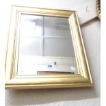 A gilt framed oblong wall mirror