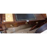 An 84cm late Georgian mahogany lowboy with later inset writing surface to top, three frieze drawers,