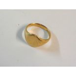 An 18ct. gold signet ring with blank cartouche - boxed