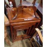 A late Chinese hardwood quartetto set of four nesting tea tables with moulded tops and open