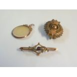 A marked 9ct brooch and open locket - sold with a plated brooch - various condition