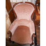 A late Victorian mahogany part show frame spoon back drawing room armchair with floral cut