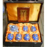 A Guo Bin Li Pin Jin Xiang Yu modern Chinese tea set with blue and white scroll decoration and brass