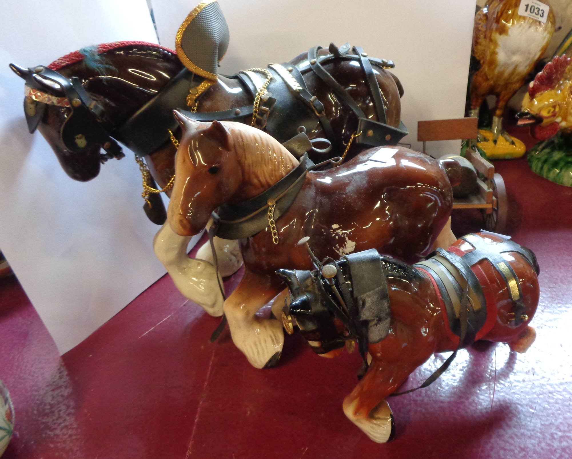 Three ceramic cart horse models of various size - sold with two associated wooden carts