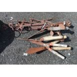 A collection of antique wrought iron chimney crooks and other fireplace equipment - sold with a