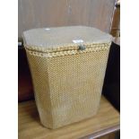 A 37cm vintage Sirrom loom style laundry basket with linen contents and original gilt finish