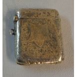 A silver flip-top vesta case with engraved decoration and initials