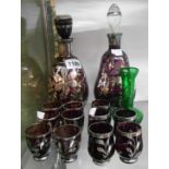 A vintage Venetian amethyst glass liqueur set decorated with silver lustre overlay comprising