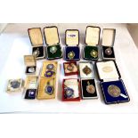 A collection of boxed and cased mainly silver and enamel fobs including Sutton & District Amateur