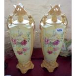 A pair of early 20th Century Viennese porcelain vases with enamel floral decoration on a yellow