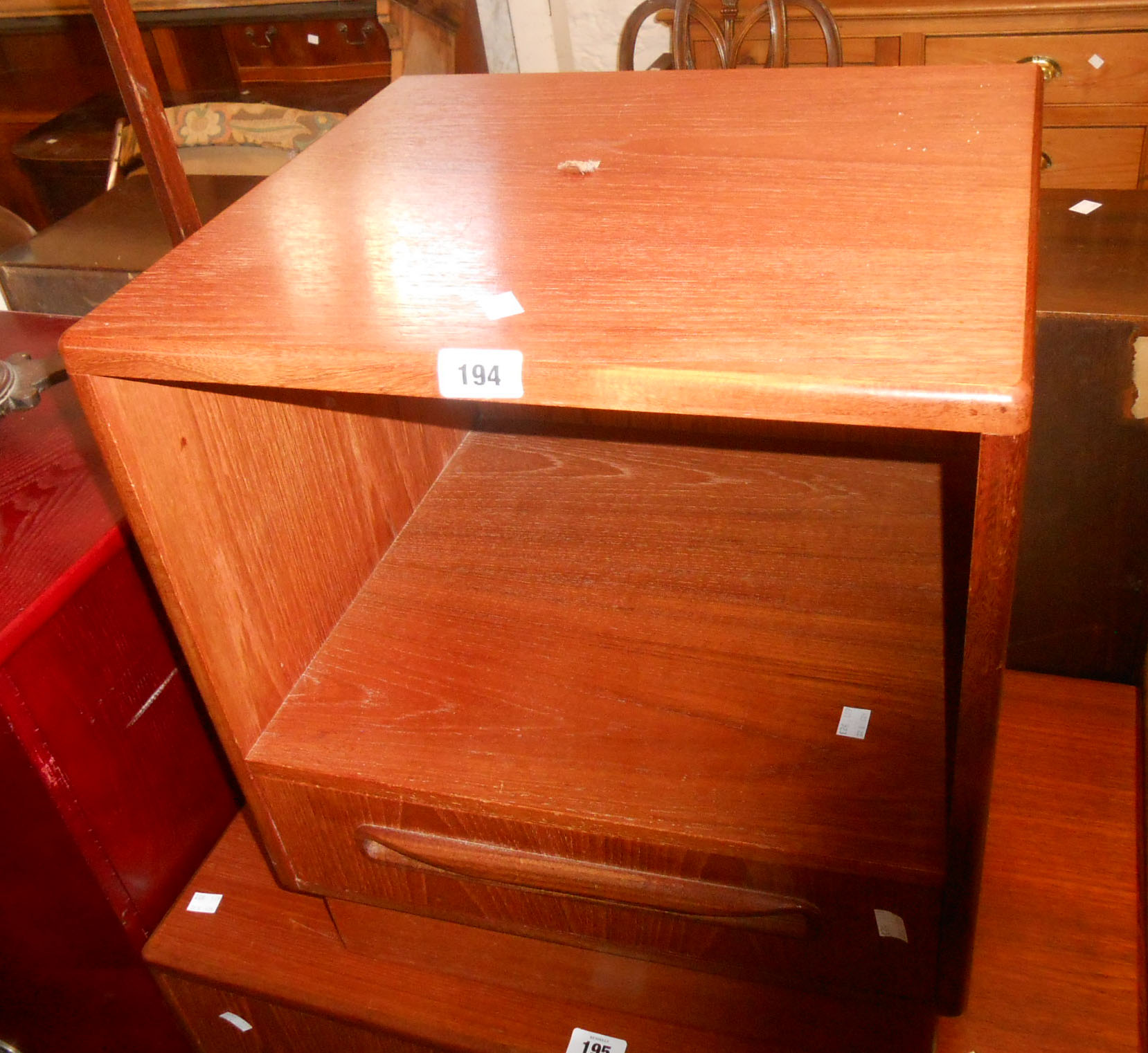 A 46cm retro G Plan "Fresco" teak and mixed wood bedside unit with recess and drawer under, set on