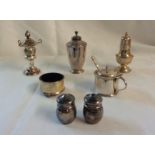 Six English silver assorted condiments comprising three pepperettes, two salts and a mustard pot -