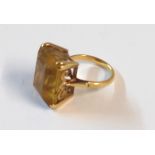 An unmarked yellow metal large citrine panel dress ring