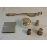 A silver fiddle pattern dessert fork, a silver topped pill jar, three thimbles and a small case