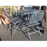 A modern metal and mesh bistro set comprising two chairs and a round folding table