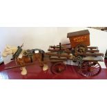 A vintage ceramic cart horse with wooden cart and associated bakers' cart