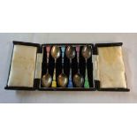 A cased set of six Birmingham silver and enamel coffee spoons - various condition