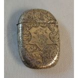 A silver flip-top lozenge shaped vesta case with initials and engraved decoration