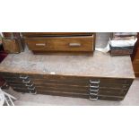 A 1.47m vintage stained pine and mixed wood plan chest of five long drawers