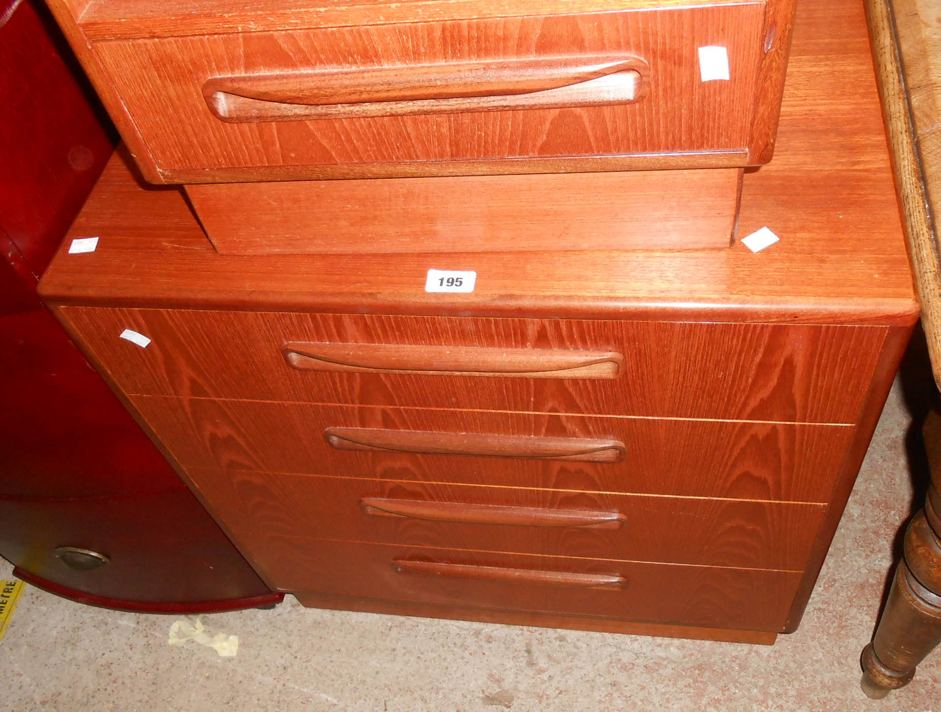 A 70cm retro G Plan "Fresco" teak and mixed wood chest of four long graduated drawers, each with